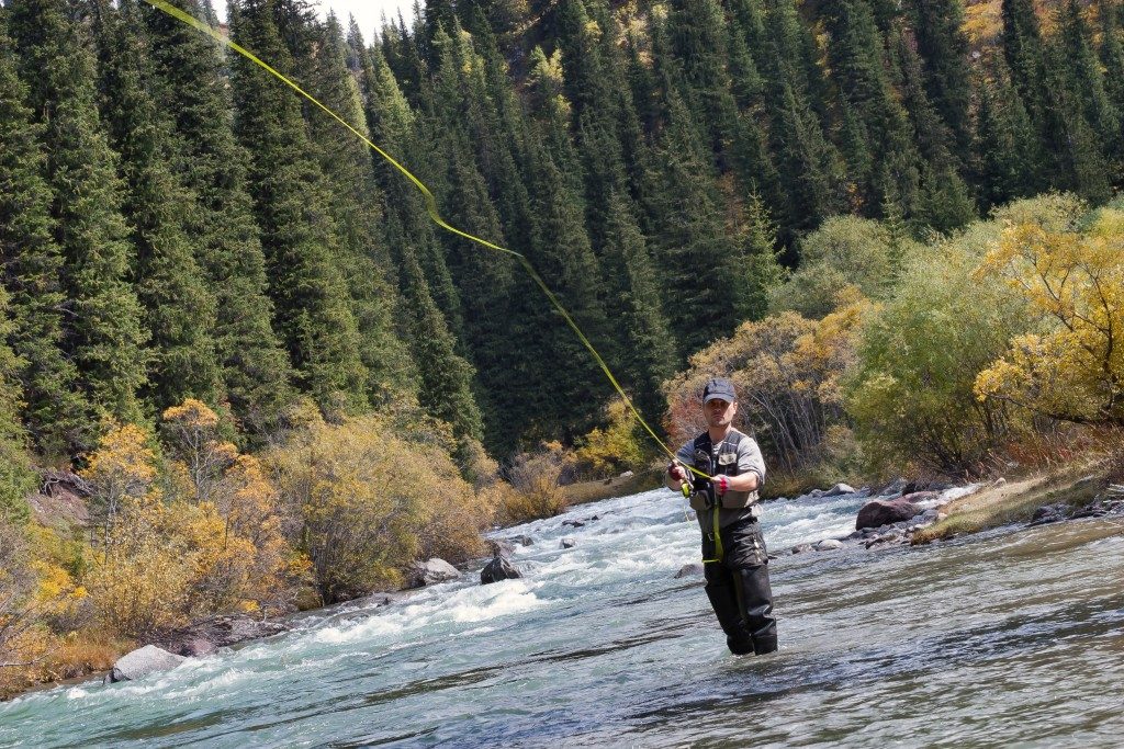 Man fishing on water