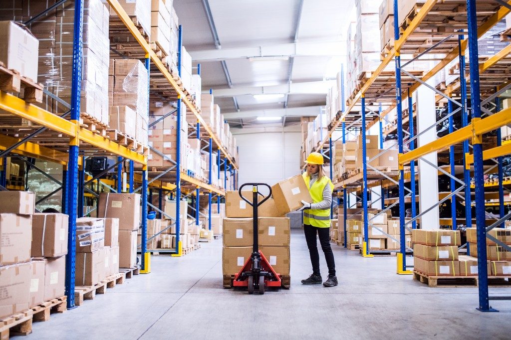 Worker loading boxes in a warehouse