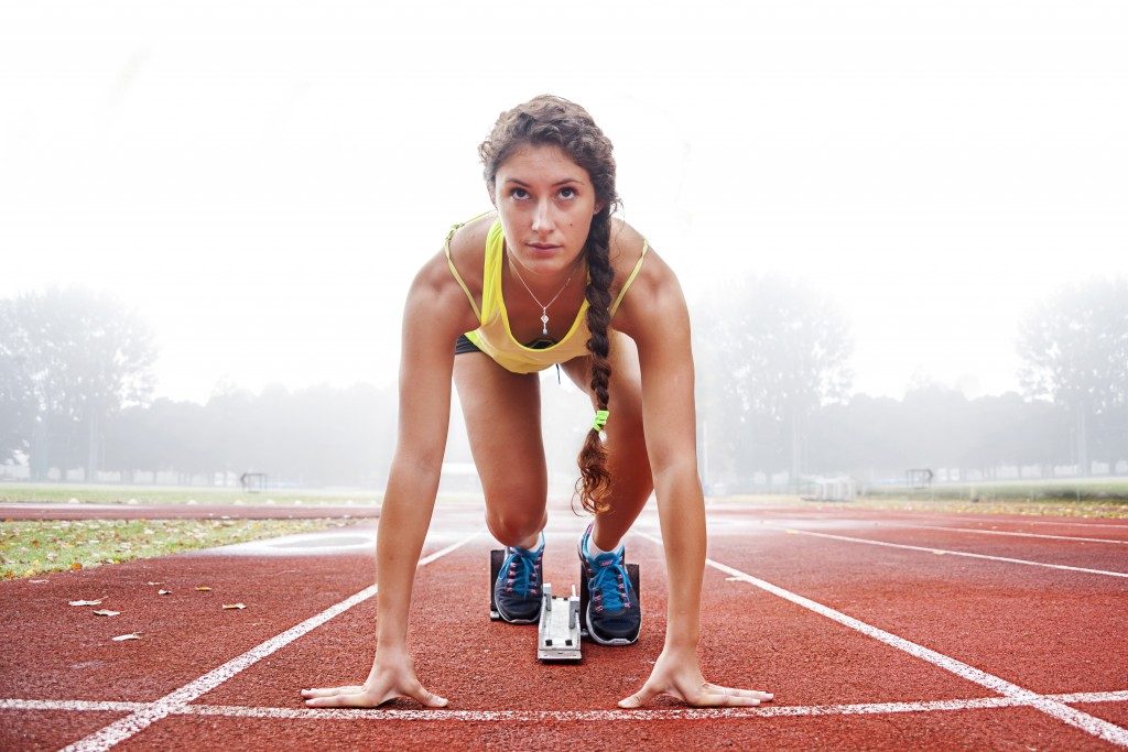 Female runner in ready stance