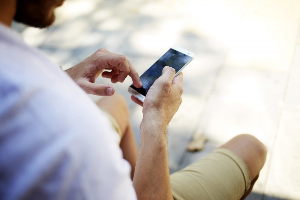 man using  his phone