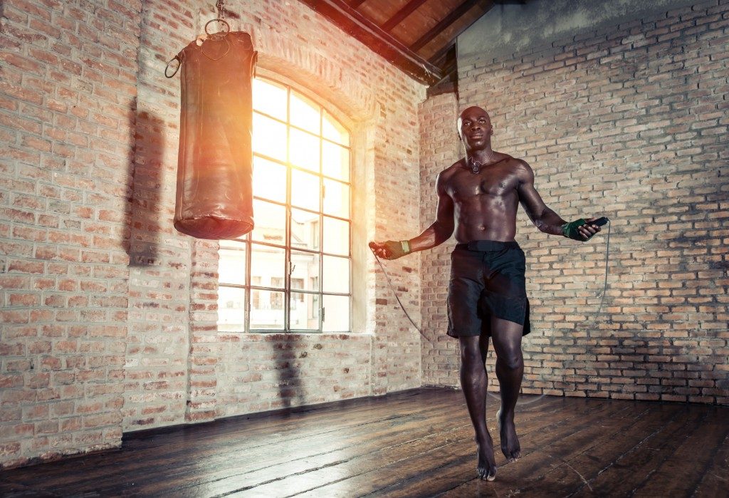 man skipping rope at the gym