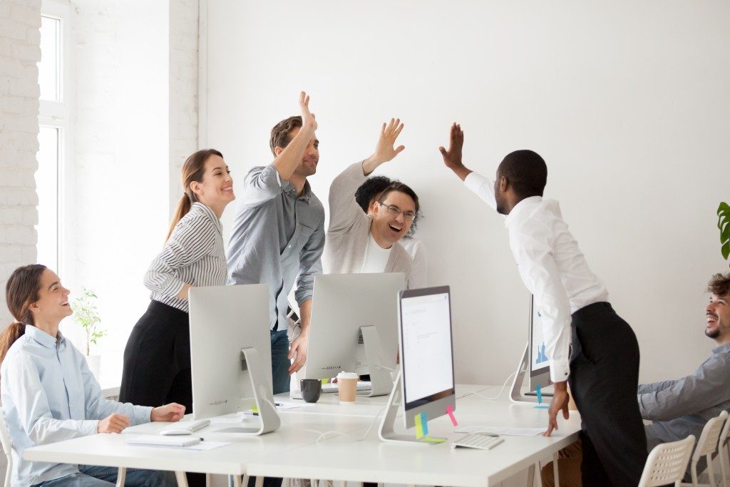 employees happy and giving high-fives