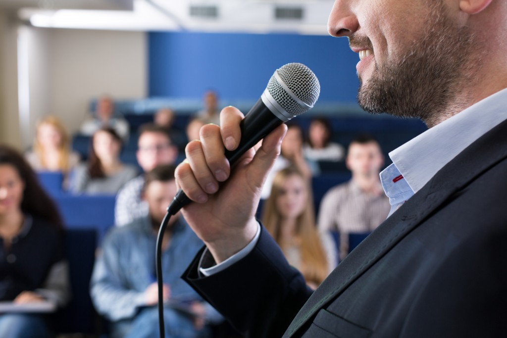 Man presenting in front of an audience