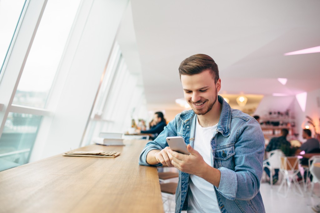 man looking at his phone