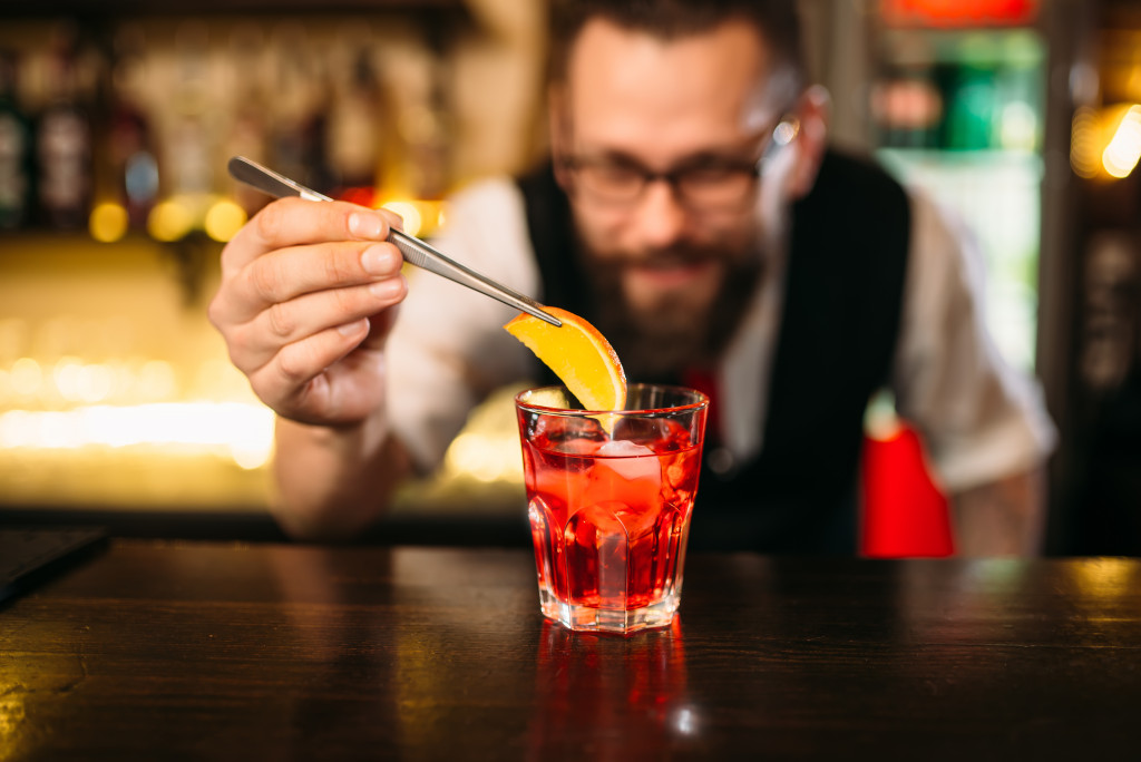 Bartender making alcohol coctail