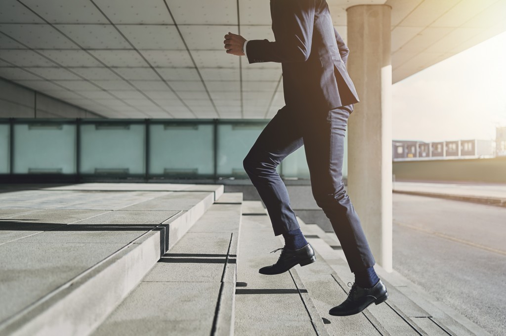 man walking up steps