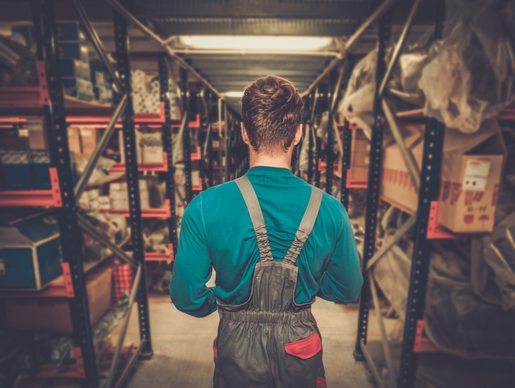 Worker on a automotive spare parts warehouse