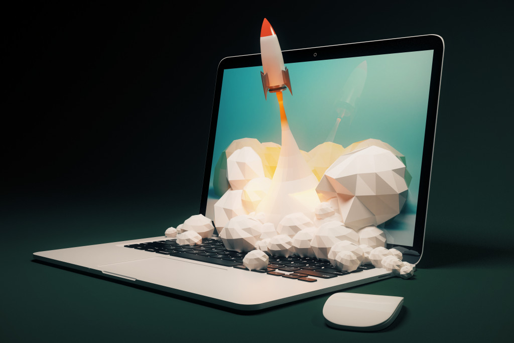 a laptop with rocket