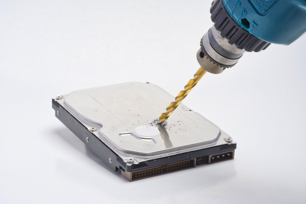 A hard drive getting destroyed to erase data