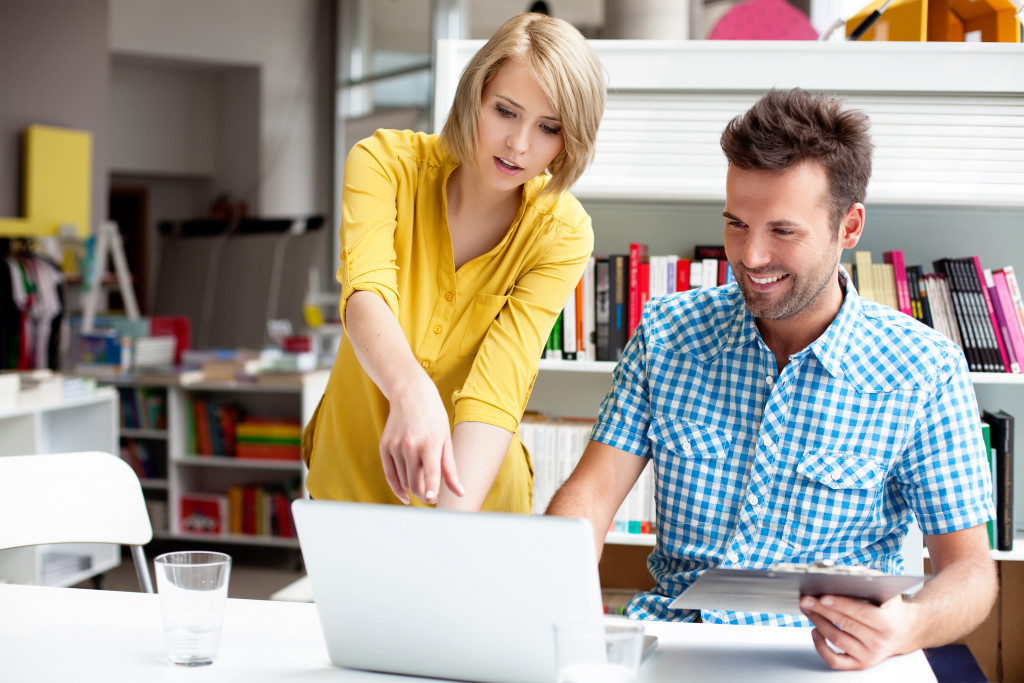 Two office workers working in their office