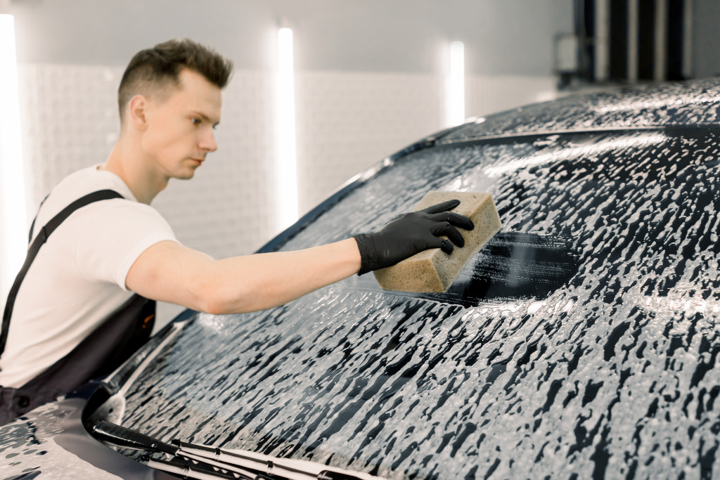 A man cleaning a car