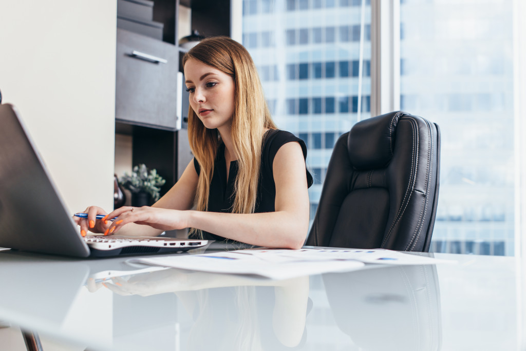 business woman doing research on her laptop