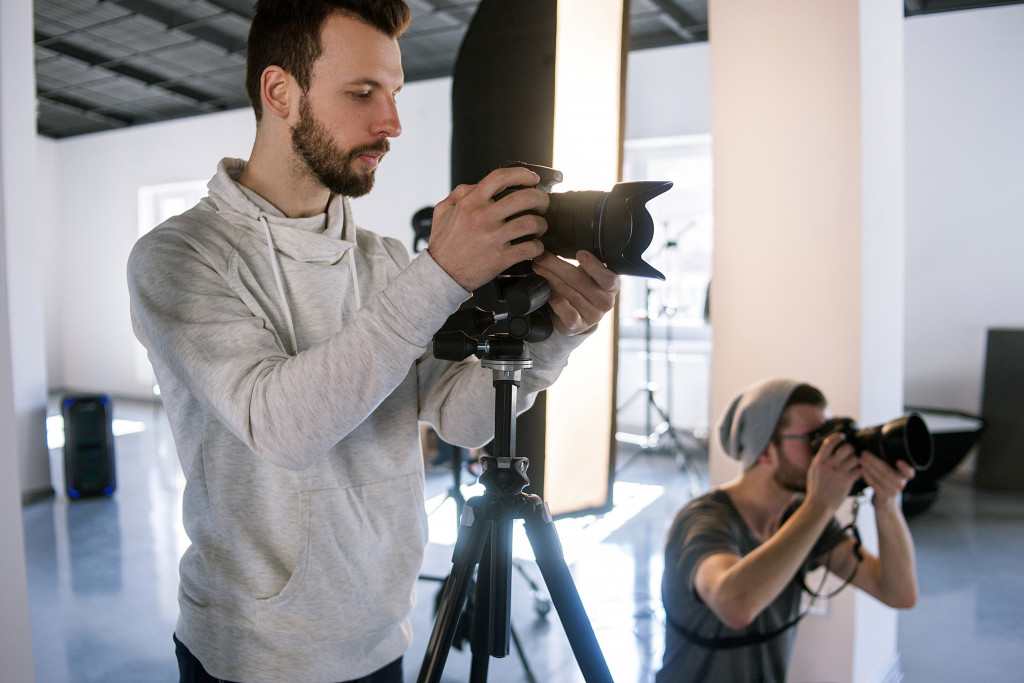 creative photographers taking shots in studio 