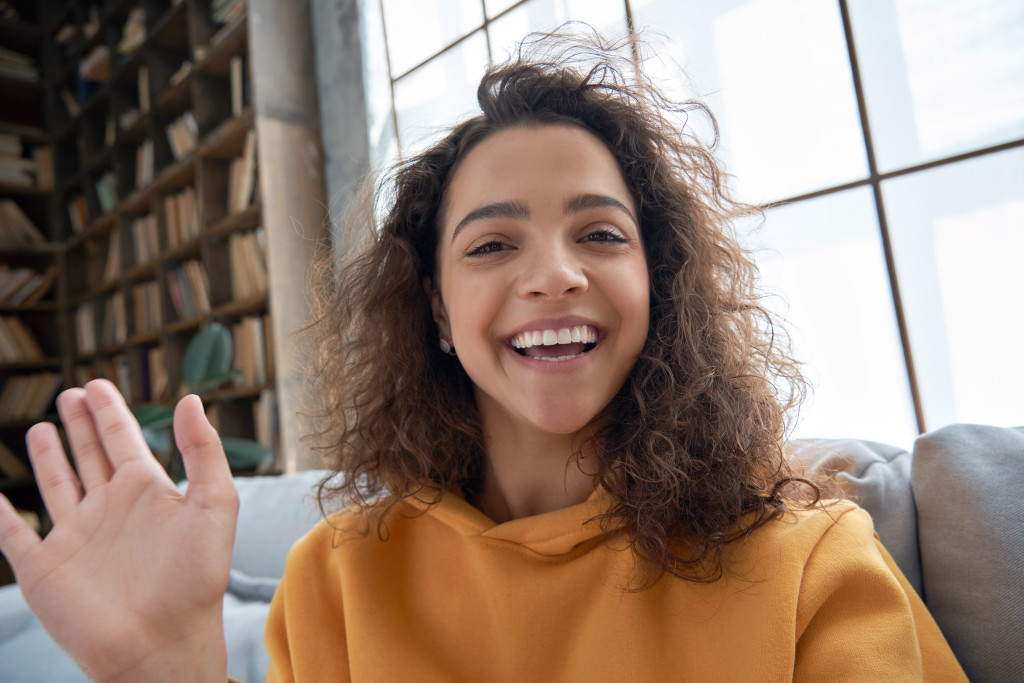 woman waving