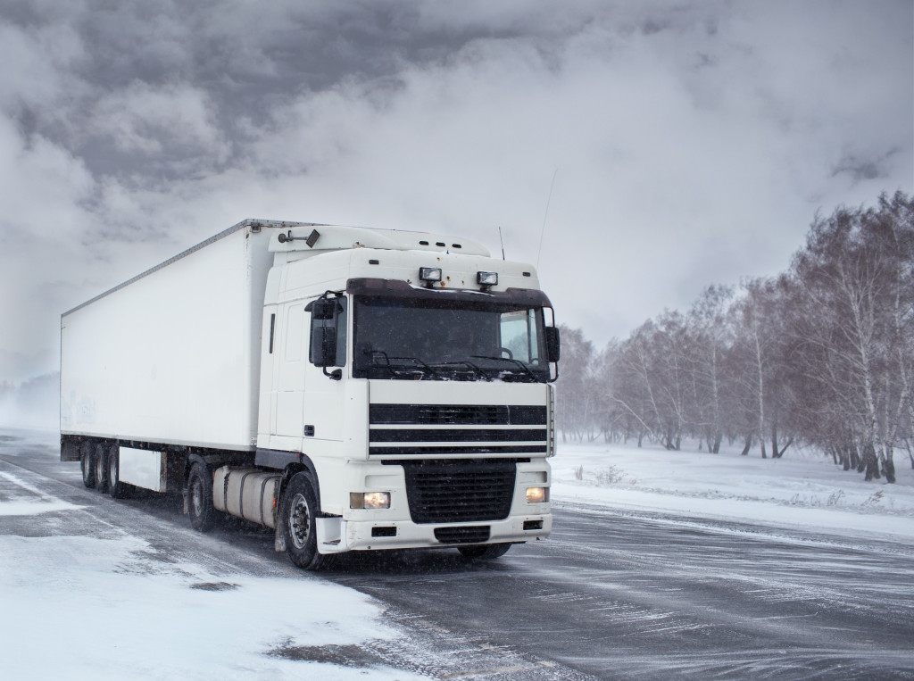 a truck travelling in the winter