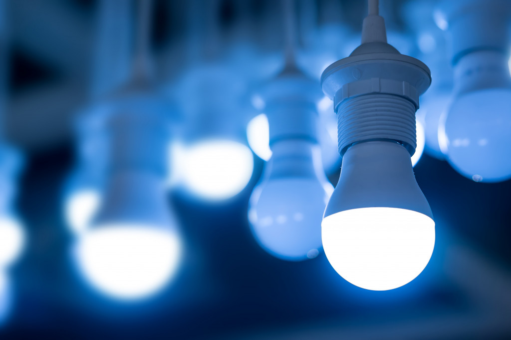 rows of blue LED light bulbs in a dark room