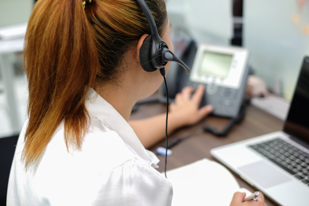 woman with headset and laptop