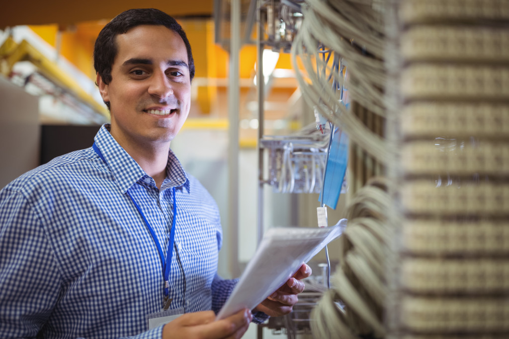 smiling male employee in the data room