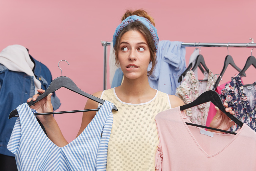 woman in the closet choosing clothes