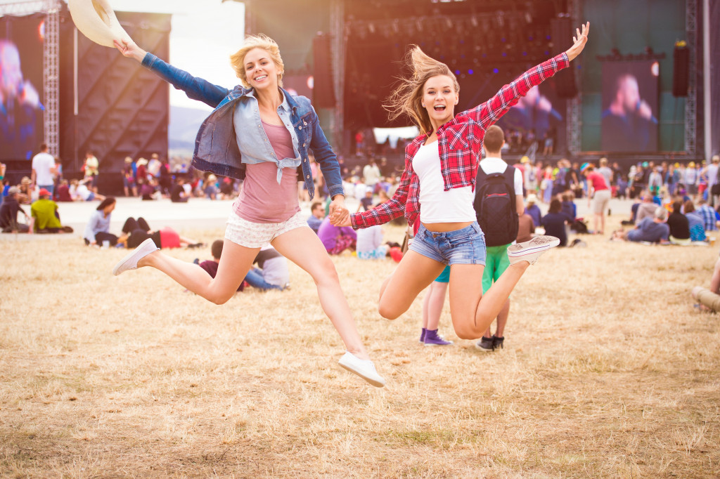 two women enjoying their first music festival experience