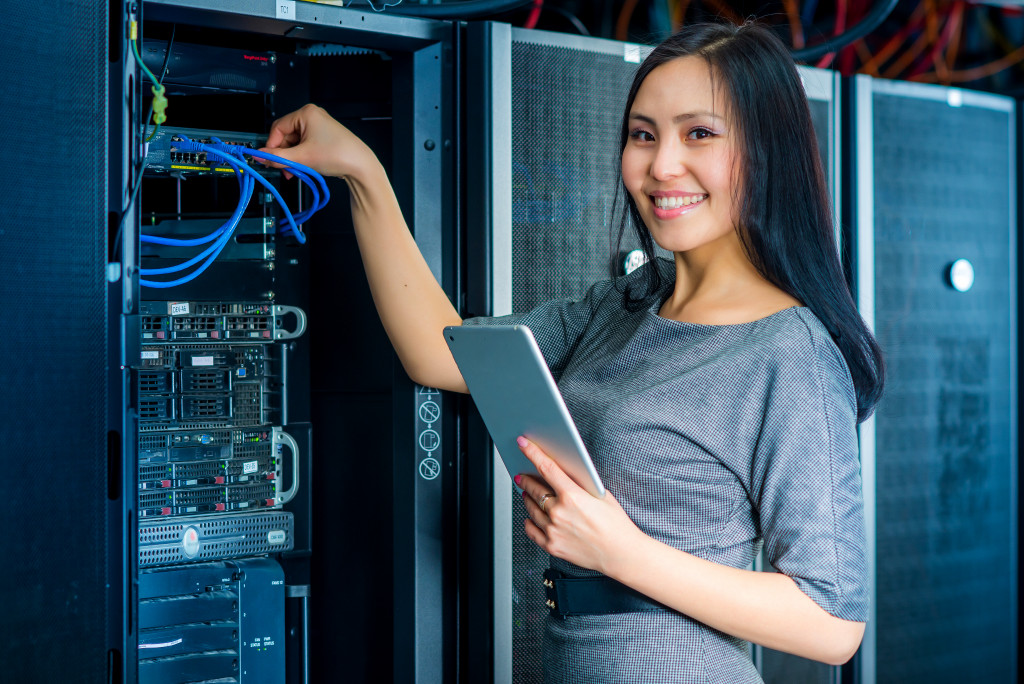 female IT specialist in the Data room