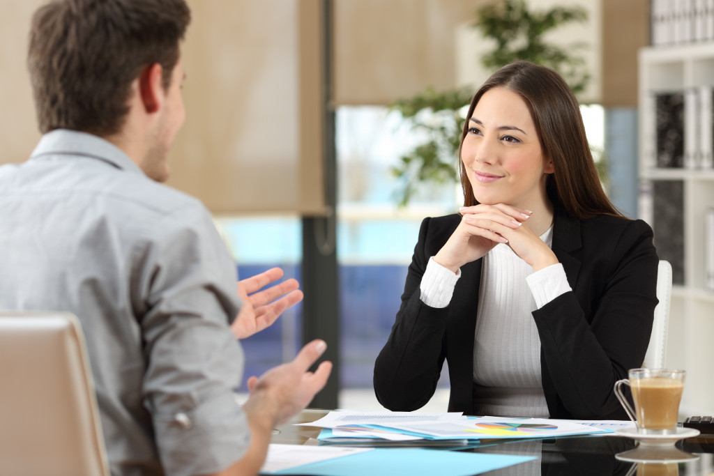 Female manager listening to feedback from an employee.