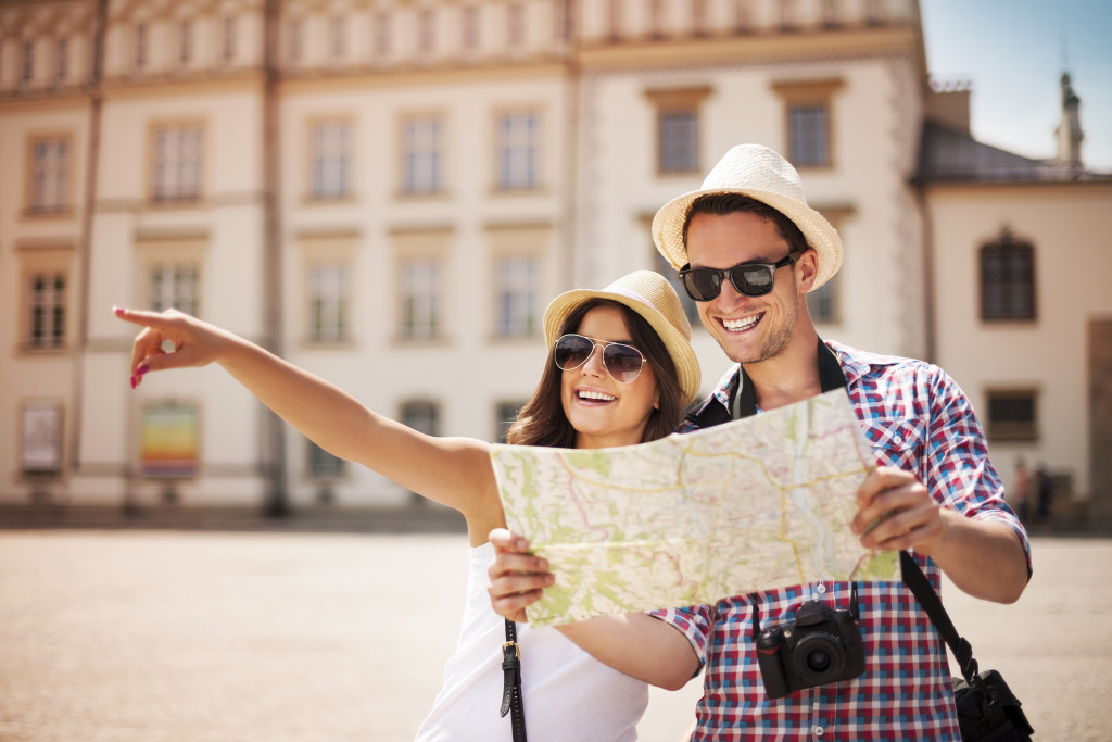happy tourists with city map